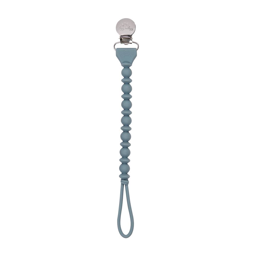 Sweetie Strap™ silicone pacifier clip in blue, stylish and functional to keep pacifiers safe and secure.