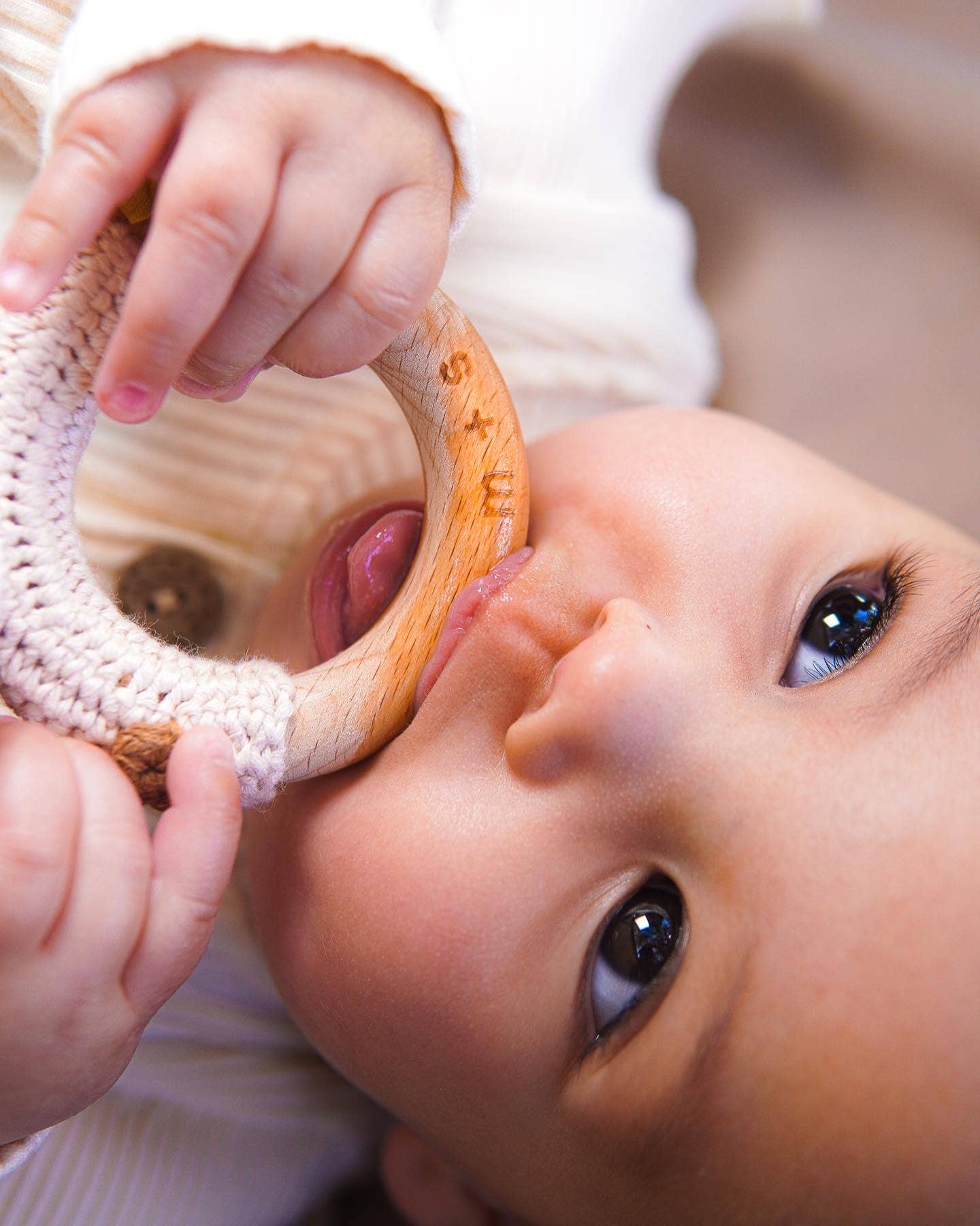 Baby playing with handmade crochet rattle, exploring textures and sounds. Ideal sensory toy for newborns to 2-year-olds.