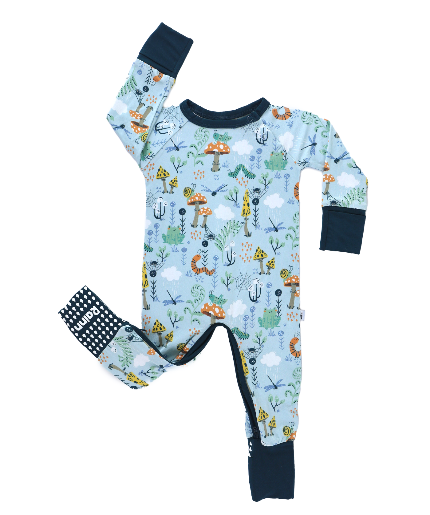 Children's onesie with nature-themed print on a white background