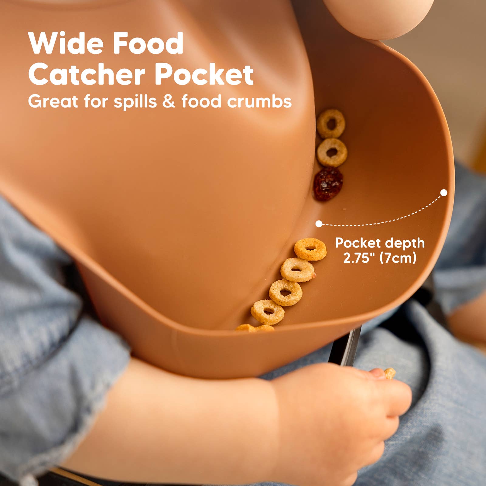 Close-up of KeaBabies silicone bib showing deep food catcher pocket for spills and crumbs during mealtime.